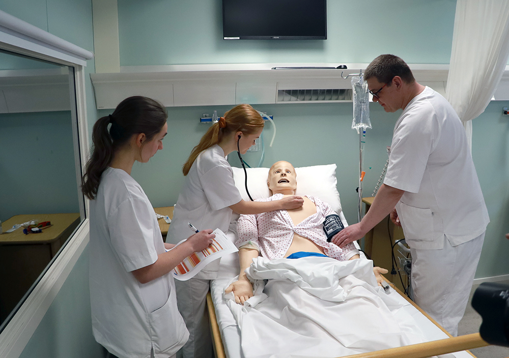 Third-year nursing students simulate various cases using the SimMan3G simulator doll. From left, Emilie Veierland, Helen Wahlstrøm, and Reidar Frisenberg